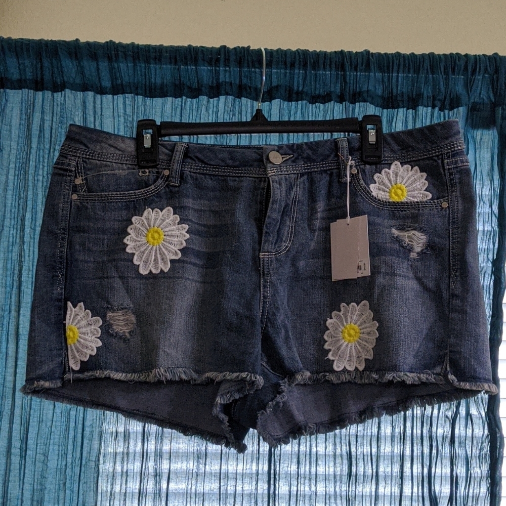 Lauren Conrad distressed denim shorts with daisies
